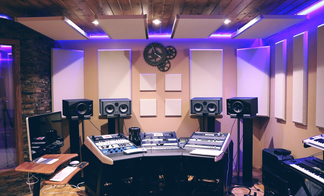 about-02 Modern recording studio with high-tech audio equipment and stylish lighting.